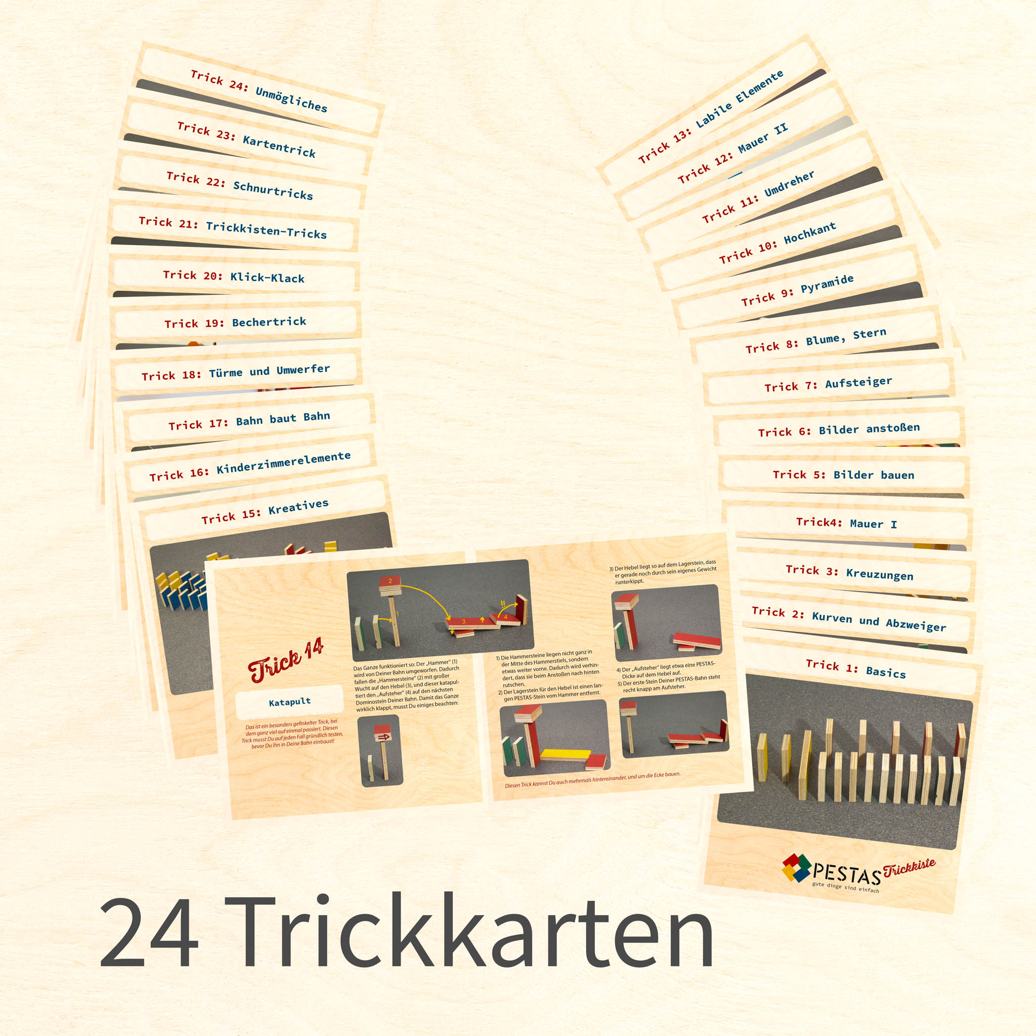 Produktbild PESTAS Trickkiste-Kartenset | Das Bild zeigt alle 24 Trickkarten aufgelegt, eine davon( Karte 14 - Katapult) ist geöffnet um den Inhalt zu demonstrieren.
Text im Bild: 24 Trickkarten